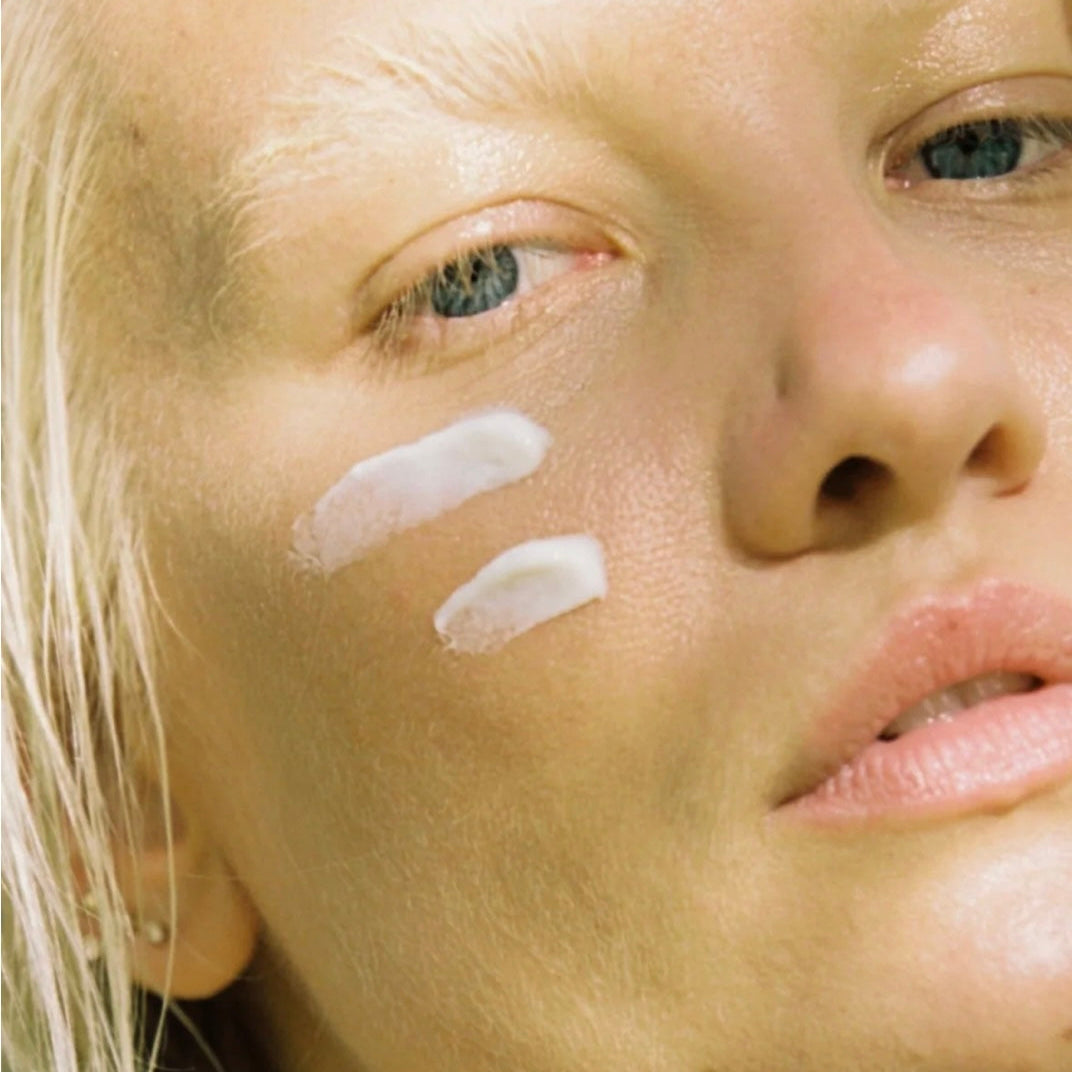 Woman resting outdoors in soft daylight for the Her Solis sunlight and SPF guide